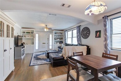 Living flows into dining.  Nice built in shelving.