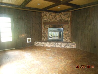familyroom has fireplace and slider door to back f