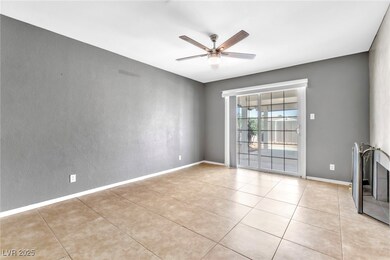 Unfurnished room featuring baseboards, light tile