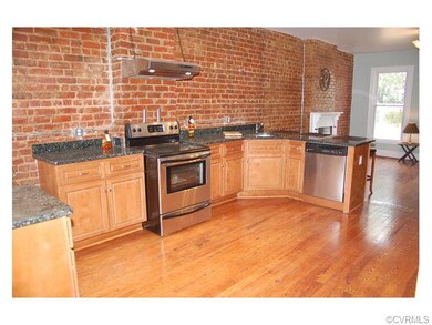 Lots of granite, stainless appliances, hardwood fl