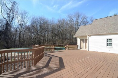 Huge private deck overlooking the pool, yard and w
