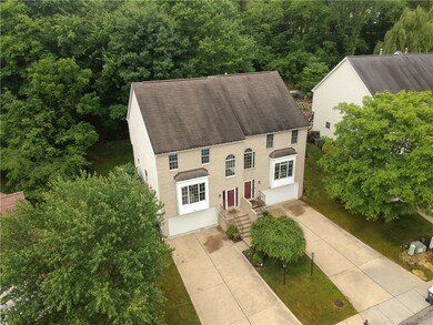 This well maintained townhouse is backed by a mature tree line.