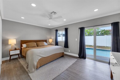 Master Bedroom with sliders to pool and backyard,