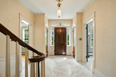 Front door, foyer, and stairs