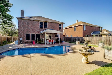 View of pool, a fenced backyard, and a patio