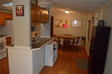 Large kitchen features island with sink, large eat