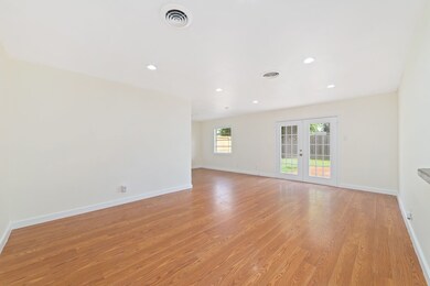 Large windows and glass doors provide easy access