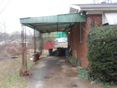 PAVED DR TO COVERED CARPORT