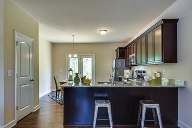 Breakfast Bar and Espresso Cabinets with Granite Countertops. Pantry.