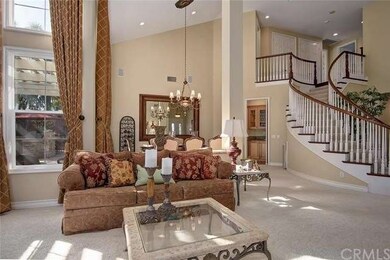 FORMAL LIVING ROOM HAS SOARING CEILINGS AND IS LIG