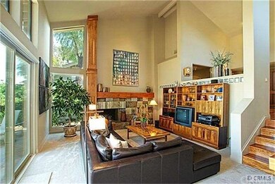 Living room with two story windows.