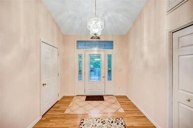 The Foyer features hardwood floors, a vaulted ceil