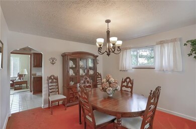The elegant dining room is accessible to the kitch