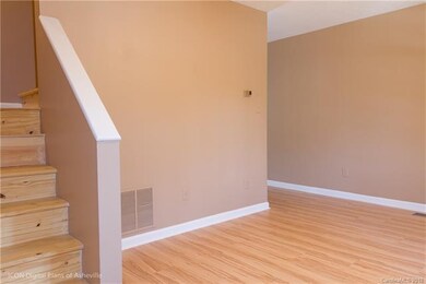 Hardwood steps to upstairs bedrooms.