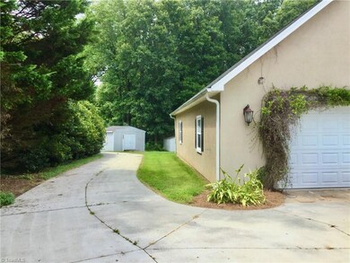 Huge 6 car garage with 2 additional storage building in the back