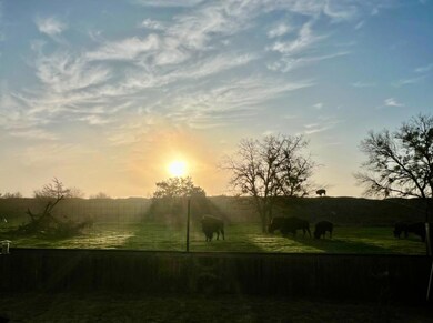 View of mountain backdrop with rural landscape