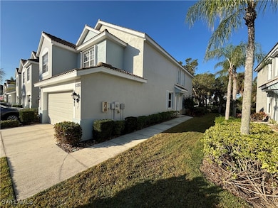 View of home's exterior featuring a garage and a y