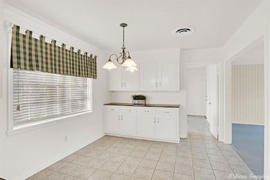 Breakfast room area with built ins and a desk