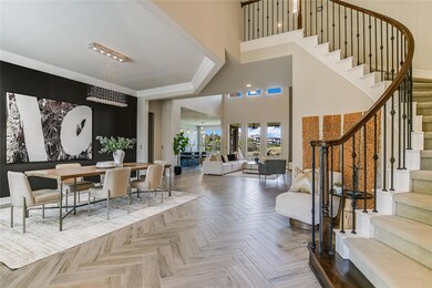 Foyer entrance featuring stairs and a towering ceiling