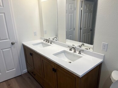 restroom with double sinks