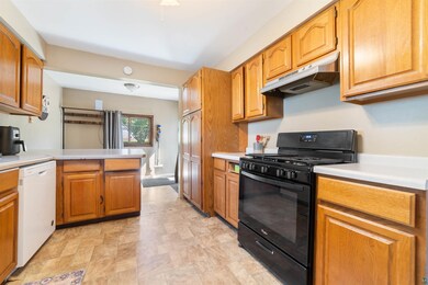 Kitchen featuring black gas range oven, dishwasher