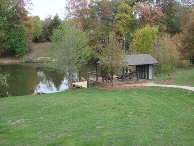 small stocked lake and covered pavillion