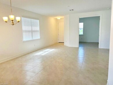 Spare room with light tile patterned floors, visib