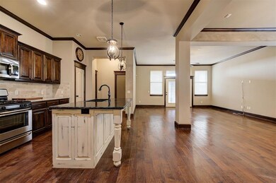 Kitchen with dark wood-type flooring, a kitchen is