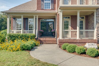 The double front doors welcome you home... along with two front porches & an upper balcony.