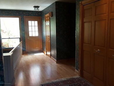 Foyer, Half Bath, Garage Entrance