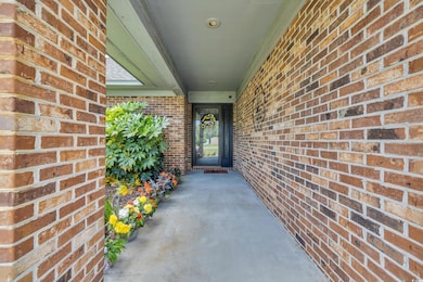 Entrance to property with brick siding
