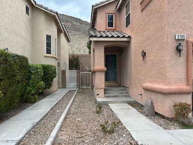 Doorway to property featuring a gate, stucco sidin
