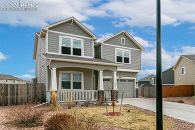 Craftsman inspired home with a porch, concrete driveway, a garage, and fence