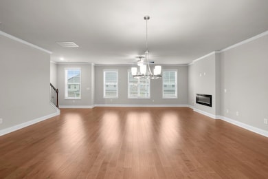 Unfurnished living room with baseboards, a notable