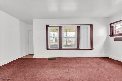Empty room with carpet flooring