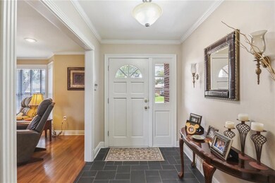 Lovely foyer entrance featuring slate look tile.