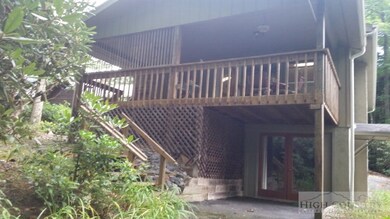 Back of cottage: Rear deck, stairs to back yard an