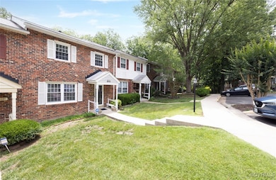 Townhome / multi-family property featuring brick s