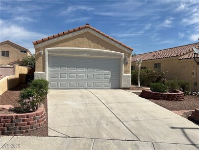 View of front facade featuring driveway, an attach