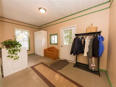 Welcoming entryway/laundry room, large room with t