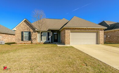 View of front of house featuring a garage and a fr