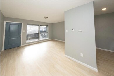 Unfurnished room featuring baseboards and light w