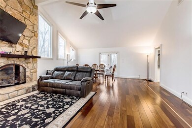 Another view of the living room with additional dining space.