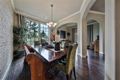The dining room is spacious and bright and open to the formal living room for easy flow from room to room.