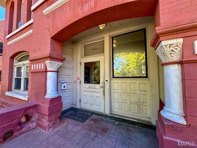 Property entrance with brick siding