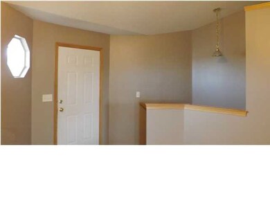 Entry Way and Stairs to Basement.
