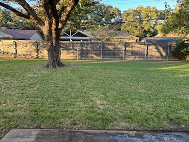 View of fenced backyard