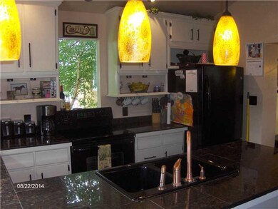 Kitchen. Lots of cabinet space.  Granite tile coun