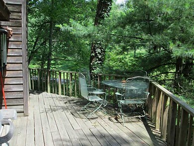 Exterior Front. Deck over looks a beautiful lot.