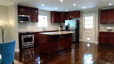 Living Room, Kitchen and Dining Room open up to lo